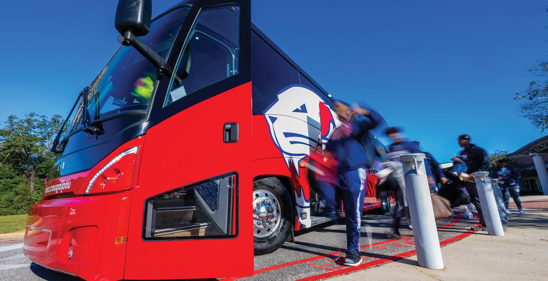 Four red and blue coach buses play an integral role in transporting University of South Alabama athletics teams. The buses are also used to transport high school students to campus for Jag Days tours. 